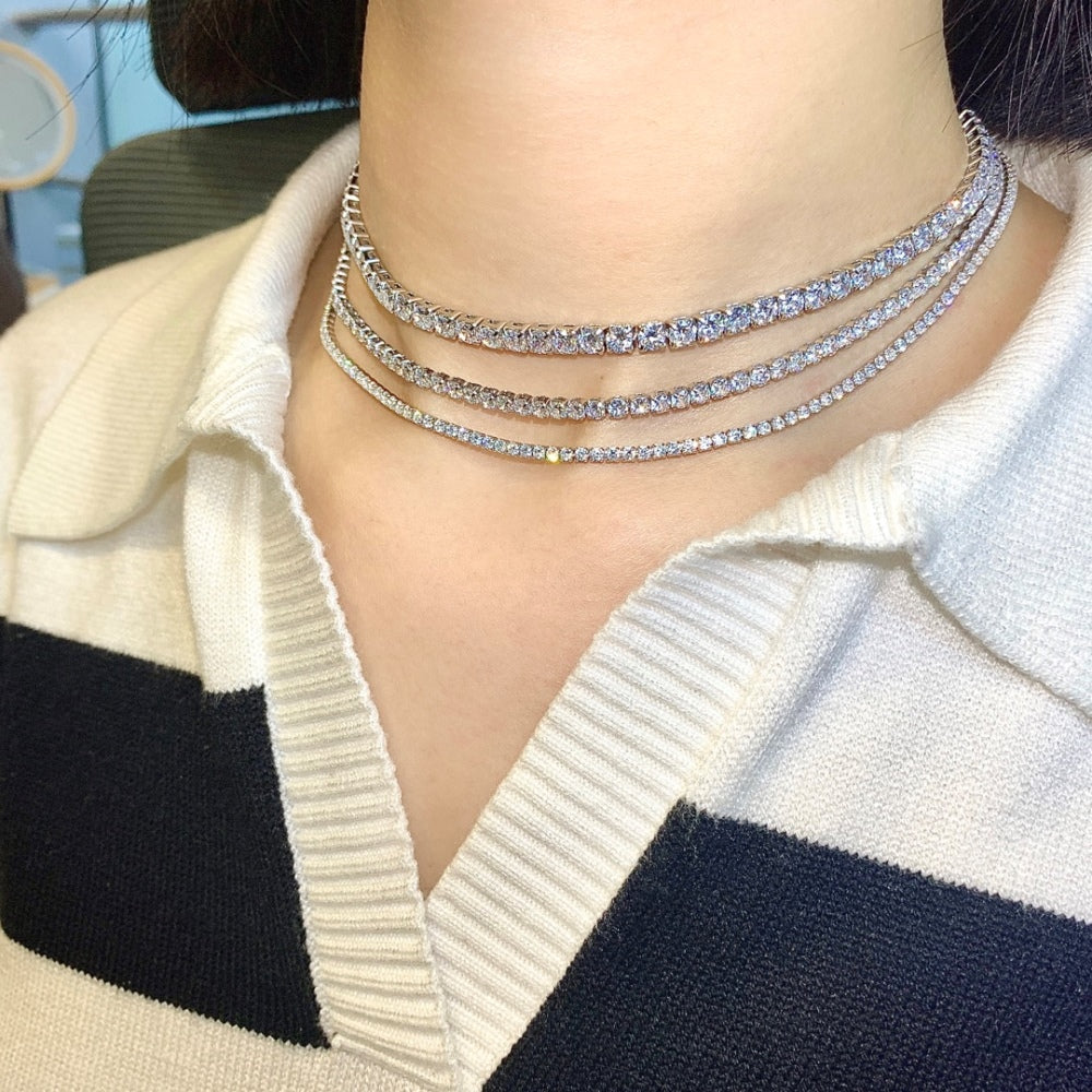 Three tennis necklaces with round shaped clear zircon stones set in sterling silver.