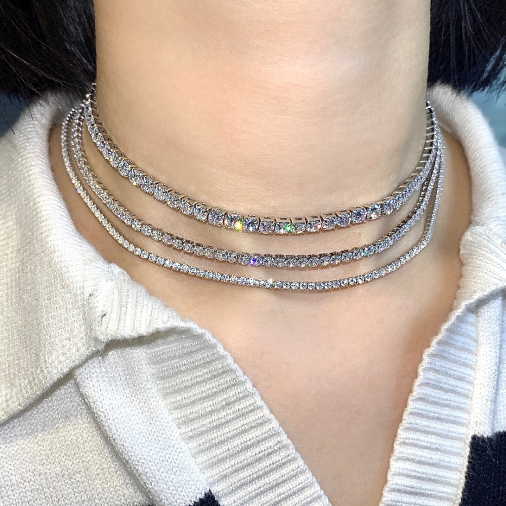 Three tennis necklaces with round shaped clear zircon stones set in sterling silver.