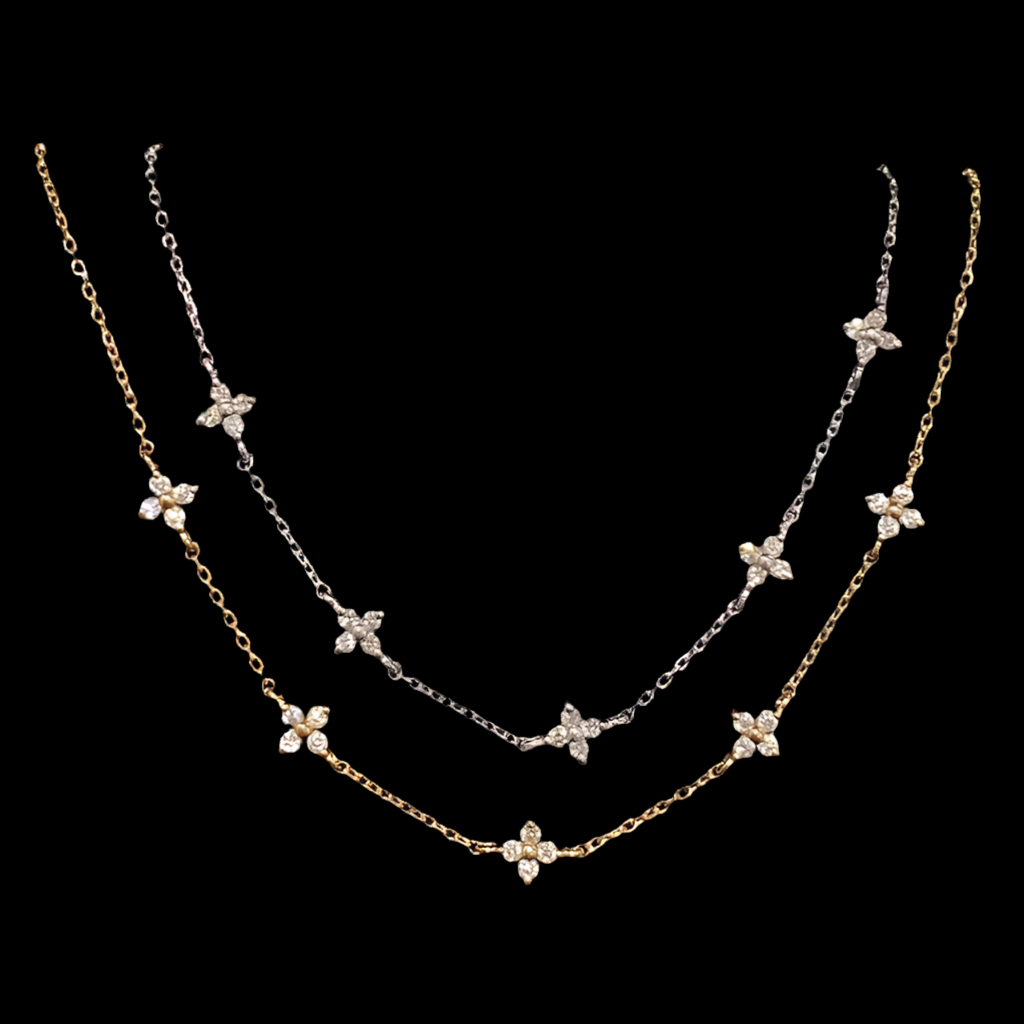 Two small dainty flower bracelets with chains in gold and silver color, featuring multiple small flowers as pendants.