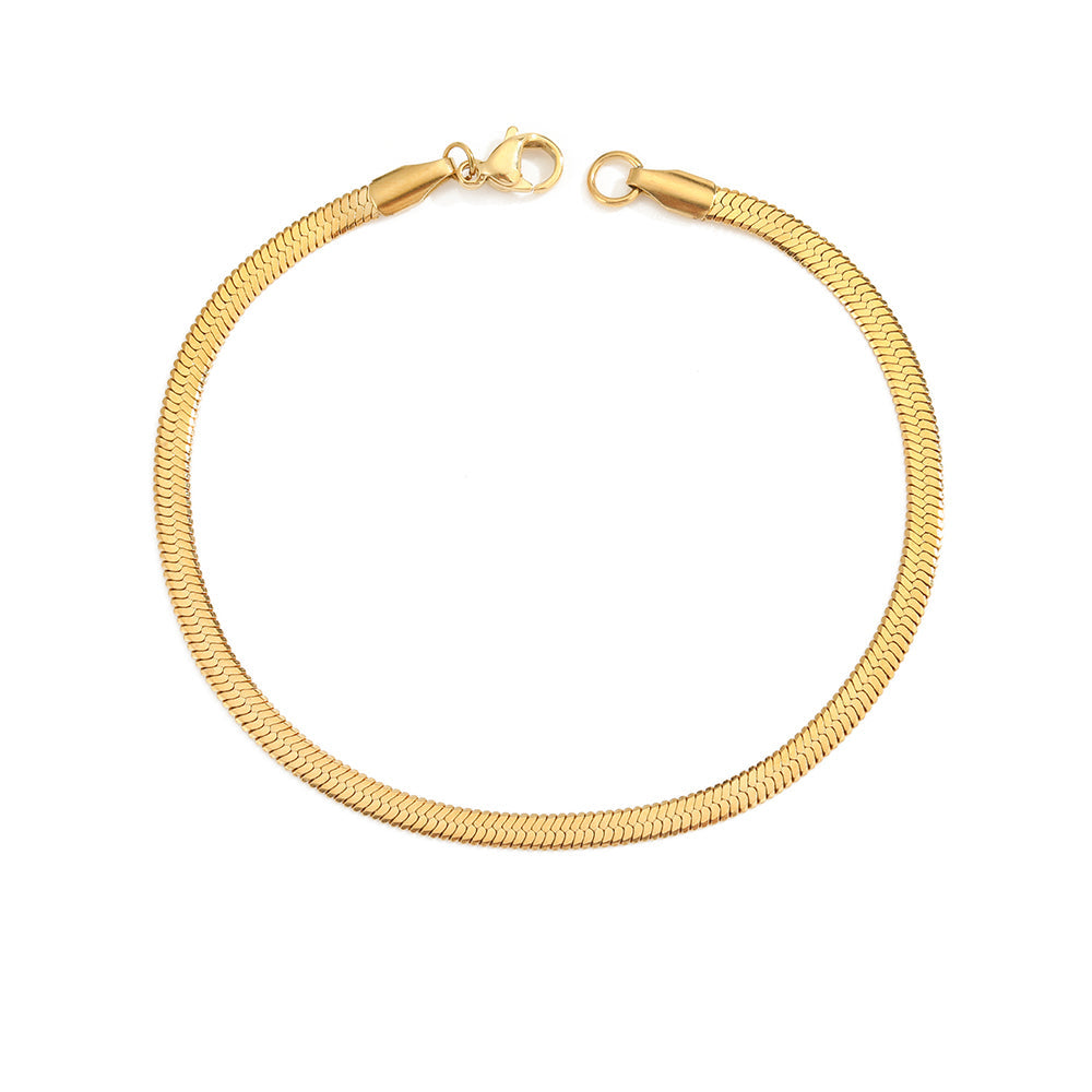 A gold-colored snake chain bracelet with a lobster clasp.
