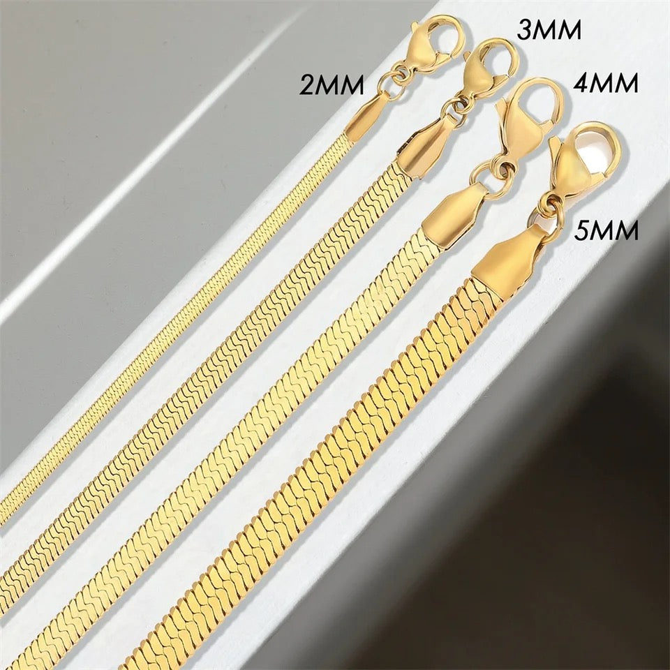 Four gold-colored snake chain bracelets with lobster clasps.