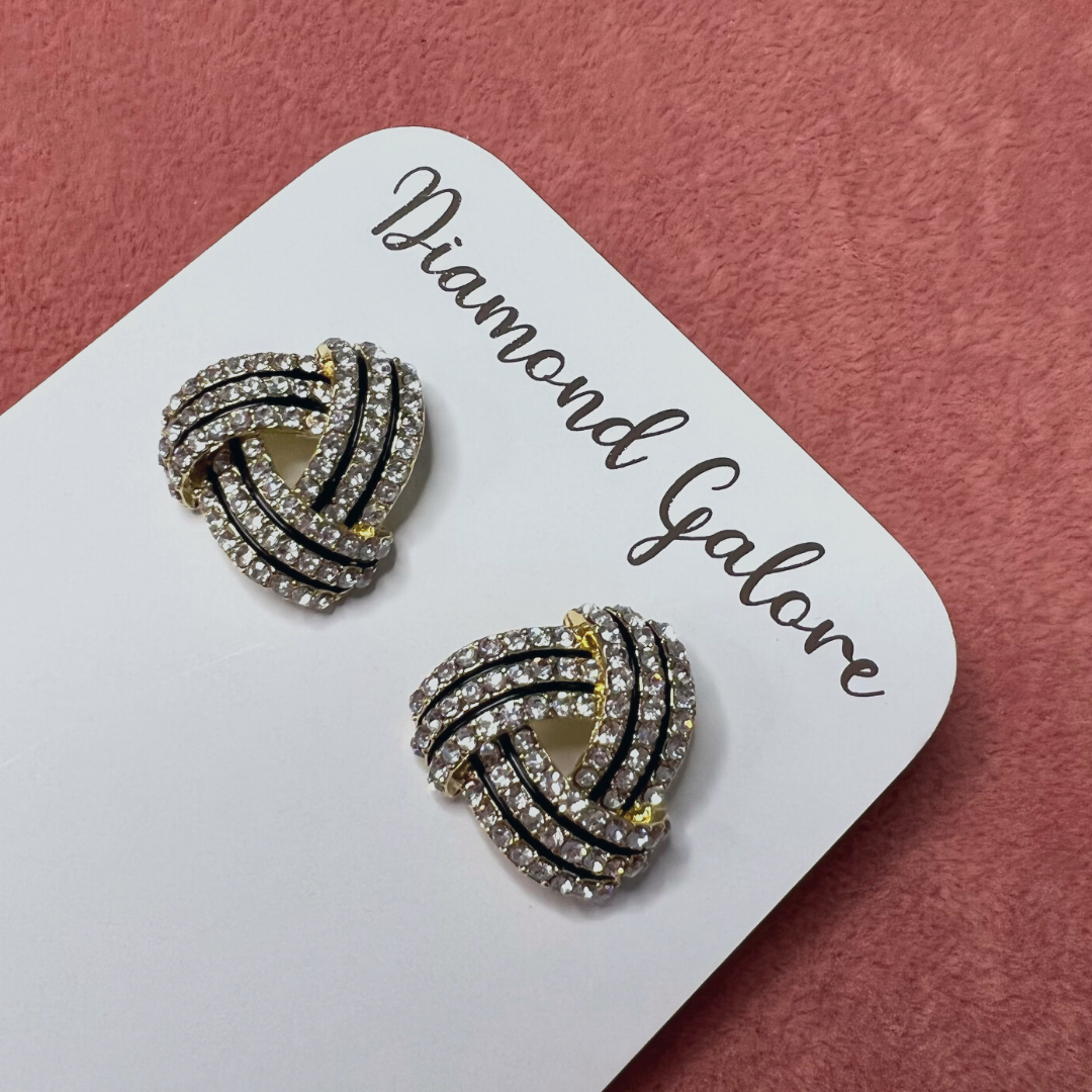 A pair of silver-colored Zara stud earrings with a geometric raised texture design.